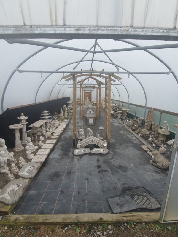 green house filled with garden ornaments